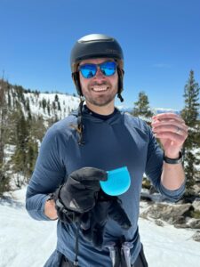 Dr. Philip is holding his Spark Aligners with the case while skiing at Mount Rose, in Nevada
