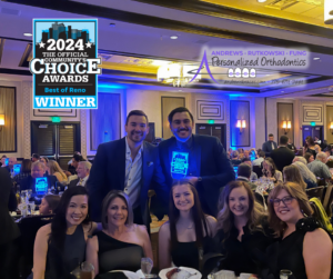 The A-Team is sitting at their table with the best of reno and andrews braces logo on the image